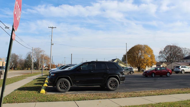 The parking lot at the corner of Bailey Street and Division Street in the City of Cheboygan is one of the properties the school district is looking to sell, if it is indeed owned by the district. Photo by Kortny Hahn