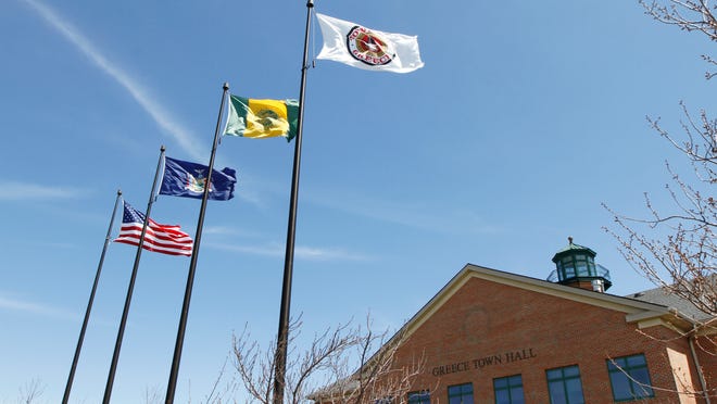 Flags fly over Greece Town Hall in Greece Monday, May 5, 2014.  The Supreme Court upheld prayers being allowed before Greece Town Board meetings.