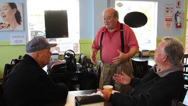 Richard Ryan, left, of Morris Plains, listens as Larry Ripley, of Morris Plains, talks about town issues with Frank Druetzler, right, mayor of Morris Plains, at a Town Tours Coffee Chat meeting on Saturday, Nov. 15, 2014.