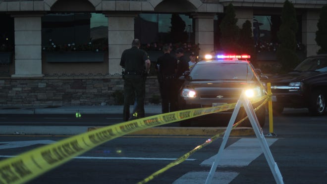 Washoe County deputies and Reno police block off South Virginia Street between Hubbard Way and the entrance of the Peppermill Resort Spa Casino on Aug. 31, 2014. Police shot a suspect following a robbery at a CVS Pharmacy at Shoppers Square in Reno.