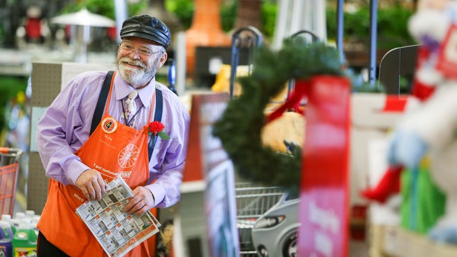 Brother George Algard offers circulars and a “God bless” to customers entering the Home Depot in Glasgow. “I’ve never seen him have a bad day,” store manager Doug Goto says of Brother George, a nondenominational missionary.