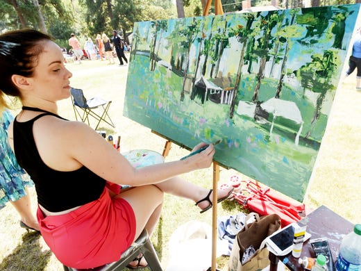Heather Evans paints during the Highland Jazz & Blues