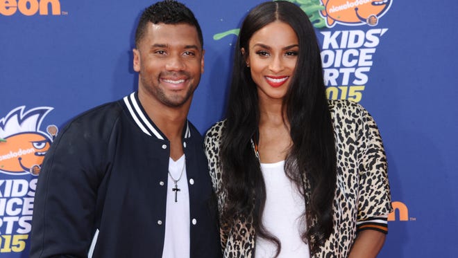 Seattle Seahawks quarterback Russell Wilson, left, and singer Ciara arrive at the 2015 Kids' Choice Sports Awards in Los Angeles. A representative for Ciara confirms that the couple are engaged. Russell posted a video on his Facebook page Friday, March 11, 2016, showing himself next to Ciara, who was wearing a bright ring.
