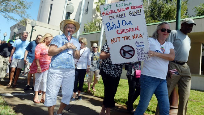 About 150 people gathered on the steps of the Indian River County Courthouse on Wednesday, Feb. 21, 2018 to rally for a ban on assault weapons. This rally, along with similar rallies across the Treasure Coast, came just a week after 17 people were killed in a mass shooting at Marjory Stoneman Douglas High School in Parkland.