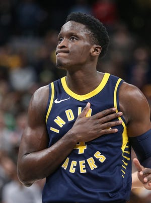 Indiana Pacers guard Victor Oladipo (4) taps his heart, looking toward the crowd that chanted "MVP" several times through the game, before shooting foul shots as the Indiana Pacers clinch the win over the Brooklyn Nets in overtime at Banker's Life Fieldhouse, Indianapolis, Saturday, Dec. 23, 2017. The Pacers won, 123-119. 