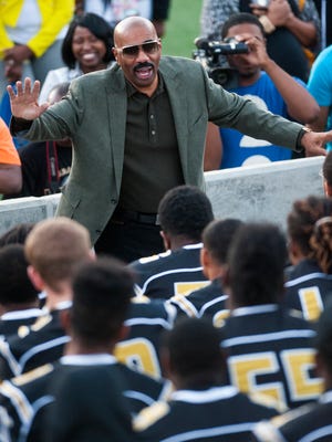 Entertainer Steve Harvey speaks with the Alabama State University football team after he announced a partnership with Alabama State at ASU Stadium in Montgomery, Ala. on Saturday April 2, 2016.  