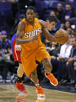 Phoenix Suns guard Brandon Knight (3) steals the ball from Detroit Pistons forward Ersan Ilyasova (23) in the first half of their NBA game Friday Nov. 6, 2015 in Phoenix, Ariz.