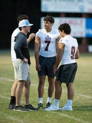 Tate High School’s Patrick Palmer, (No. 7) remains sidelined from an injury last Oct. during Thursday night’s spring football game against Pine Forest High School. 