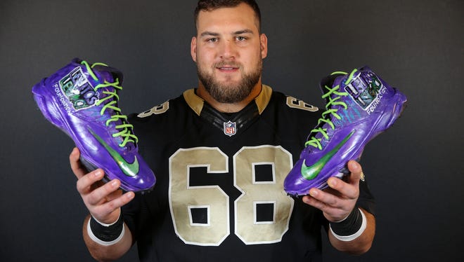 New Orleans Saints lineman and St. Clair alum Tim Lelito poses with his Lelito Legacy Foundation cleats he wore for NFL's "Cleats Week" in week 13.