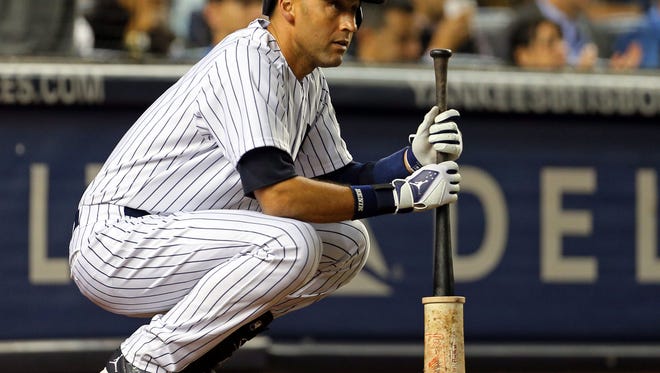 Yankees shortstop Derek Jeter waits on deck for his at-bat against the Tampa Bay Rays during the third inning at Yankee Stadium Wednesday night.