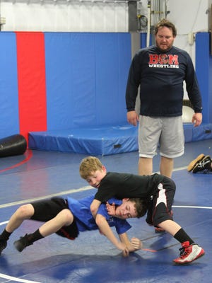Matt Maschmann is coaching technique with Jake Maurer and Kieran Sacora.