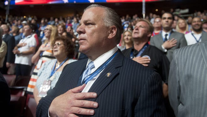 New Jersey Senate President Stephen M. Sweeney stands during the national anthem at the Democratic National Convention.