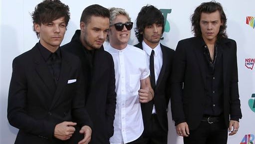 Boy band One Direction, from left to right, Louis Tomlinson, Liam Payne, Niall Horan, Zayn Malik, and Harry Styles arrive for the Australian Recording Industry Association (ARIA) awards in Sydney, Wednesday.