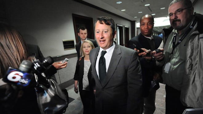Former Indiana Secretary of State Charlie White declines to answer questions from reporters after he was sentenced by a judge in 2012 for casting a ballot in a district in which he no longer lived. (Matt Detrich / The Star)