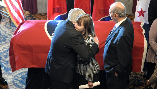 Lt. Governor and Speaker of the Senate Randy McNally,left, hugs Speaker of the House Beth Harwell as former Speaker of the House Jimmy Naifeh stands by during Sen. Douglas Henry’s visitation at Tennessee State Capitol Legislative Library on Thursday, March 9, 2017.
