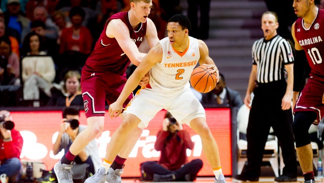 Tennessee forward Grant Williams (2) dribbles around South Carolina forward Jason Cudd (33) during a game between Tennessee and South Carolina at Thompson-Boling Arena in Knoxville, Tennessee on Tuesday, February 13, 2018.