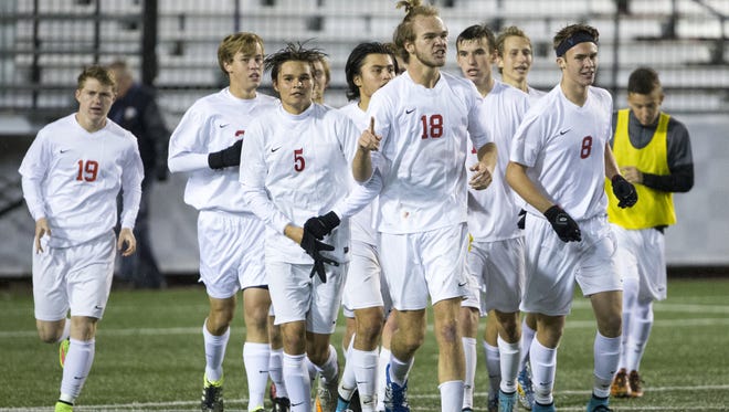Center Grove High School players cheer their state title, IHSAA Boys Class 2A State Soccer Finals, won by Center Grove High School 4-0 over Harrison (West Lafayette) High School, Michael A. Carroll Track & Soccer Stadium, IUPUI, Indianapolis, Saturday, Oct. 31, 2015.