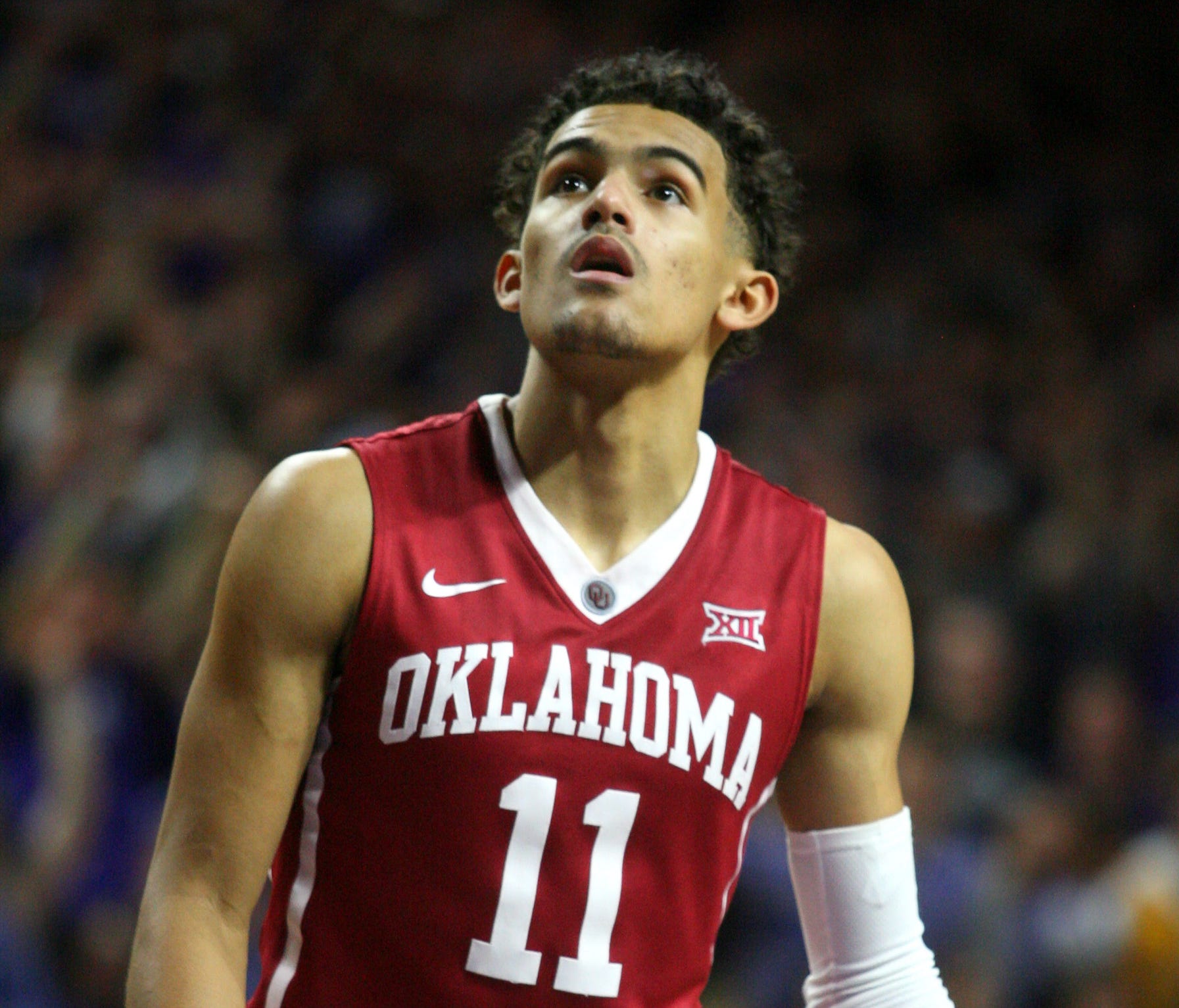 Oklahoma Sooners guard Trae Young (11) looks at the clock late in a game against the Kansas State Wildcats at Bramlage Coliseum.