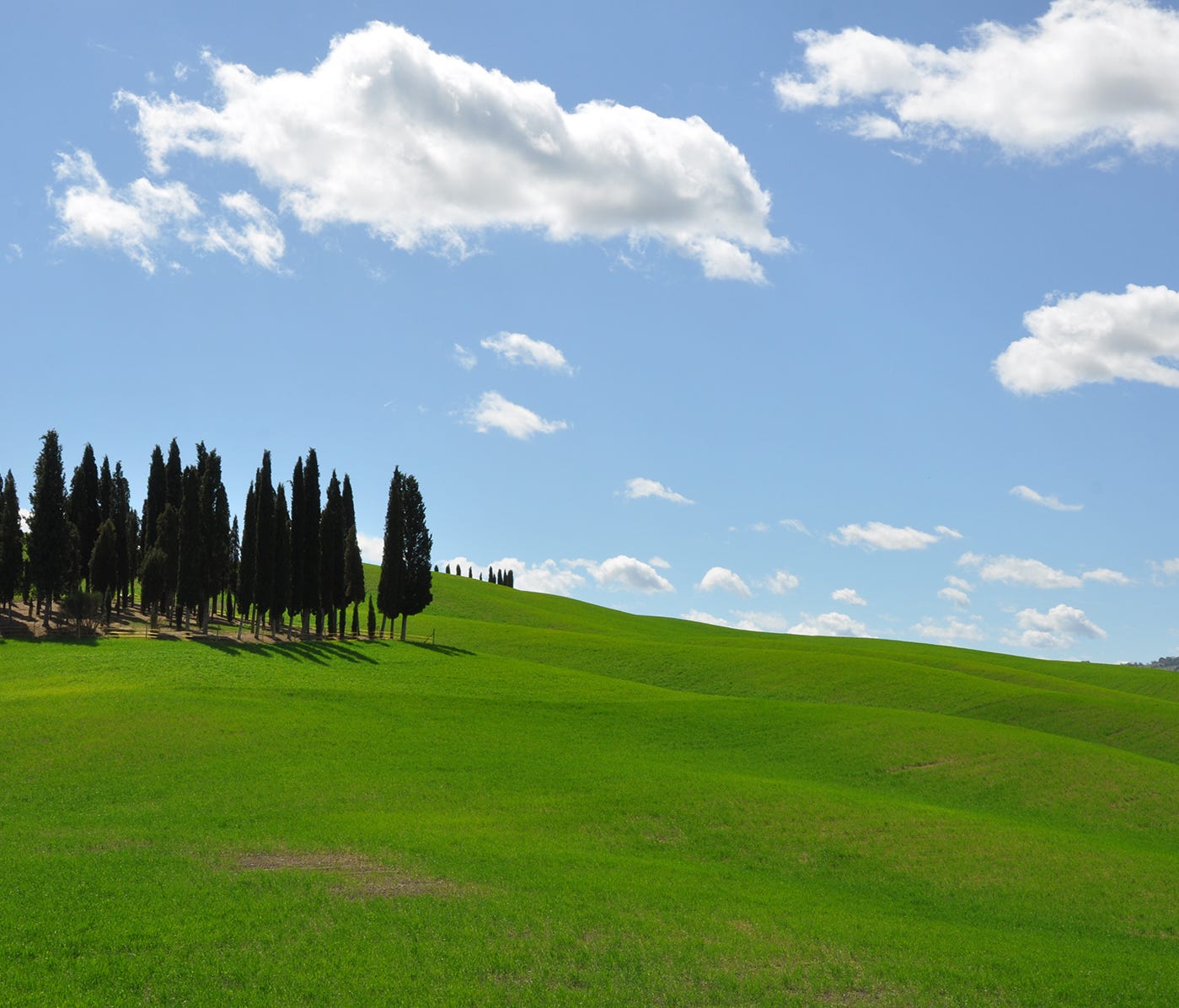 Much of the Tuscan countryside is a confection of green hills and blue sky.