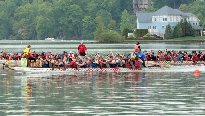 Competitors race across Lake Mohawk during the dragon boat races in Sparta, NJ, on Sunday, May 17, 2015.