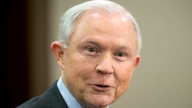 In this March 15 file photo, Attorney General Jeff Sessions speaks to law enforcement officers in Richmond, Va. "The lawlessness, the abdication of the duty to enforce our immigration laws, and the catch and release practices of old are over," Sessions said April 11 in Nogales, Ariz.
