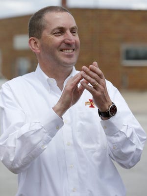 Iowa State athletic director Jamie Pollard applauds during the first stop of the 2014 Cyclone Tailgate Tour in Paton on May 13, 2014.