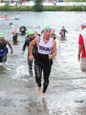 Dave McQuillan comes out of the water after the 2013 Ironman Lake Placid.
