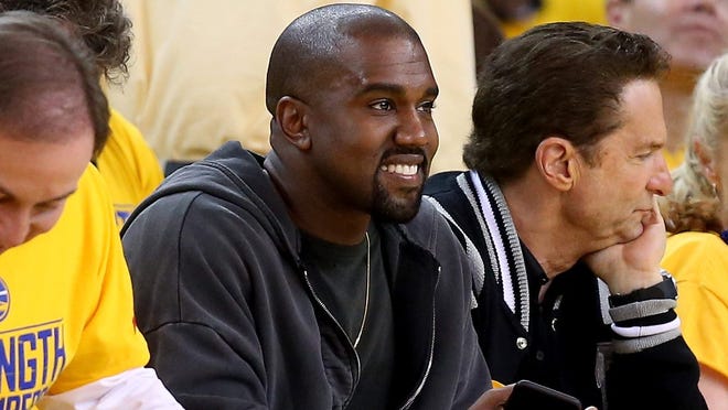 Rapper Kanye West, shown at an NBA game in 2015, on Tuesday discussed his work with University of Wisconsin-Madison graduate Virgil Abloh, recently chosen as head menswear designer at Louis Vuitton.