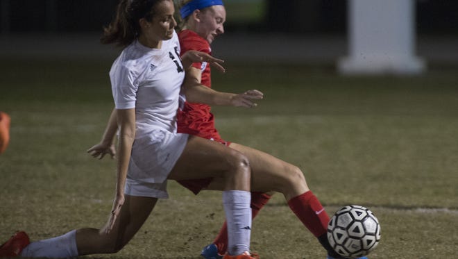 Mariner Sophia Restrepo (left) fights for the ball with  North Fort Myers Madison Lampkins during Class 3A  Region 4 semifinals game, Tuesday (1/26/16) at Mariner High School in Cape Coral.