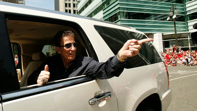 Red Wings  owner Mike Ilitch rolls down the parade route in the Wings' Stanley Cup parade down Woodward in Detroit, June 6, 2008.
