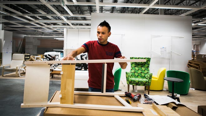 November 1, 2016 - Orlando Bohorquez assembles a bar stool at the new Ikea Memphis store, located at 7900 IKEA Way. The Swedish furniture store is set to open on Dec. 14.
