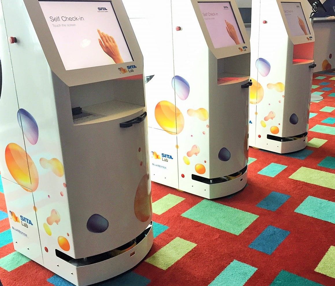 The new KATE robotic kiosks on display at the Airport Transport IT Summit in Brussels.