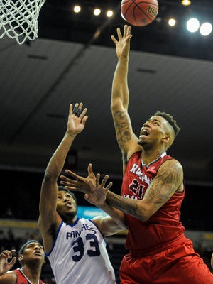 UL Ragin' Cajuns forward Shawn Long (21) attempts a shot during the second half of a men's semifinal game in the Sun Belt Conference Championship tournament at the UNO Lakefront Arena in New Orleans, La., Saturday, March 14, 2015. 