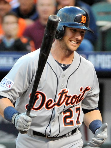 The Tigers' Andrew Romine strikes out after a long battle in the second inning.
