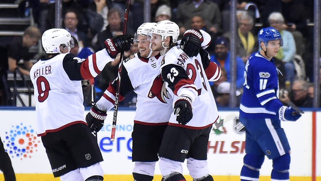 Nov 20, 2017: Arizona Coyotes defenceman Oliver Ekman-Larsson (23) celebrates with forwards Clayton Keller (9) and Max Domi (16) after scoring a goal in the second period against Toronto Maple Leafs at Air Canada Centre.