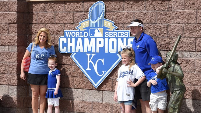 A family poses for pictures at Surprise Stadium in Arizona.