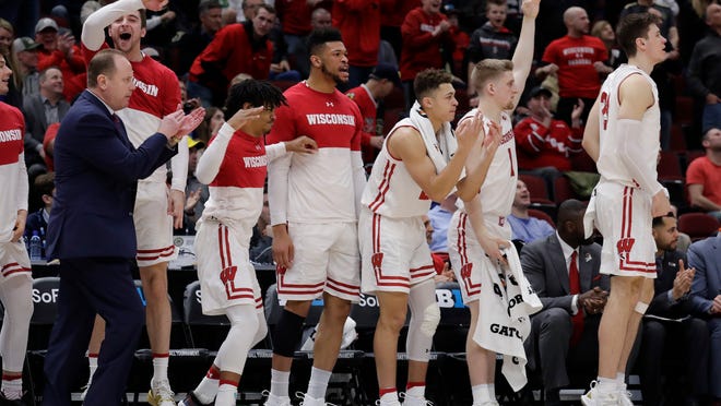Wisconsin bench celebrate after D'Mitrik Trice scores a 3-point backet during the second half of an NCAA college basketball game against Nebraska in the quarterfinals of the Big Ten Conference tournament, Friday, March 15, 2019, in Chicago. Wisconsin won 66-62. (AP Photo/Nam Y. Huh)