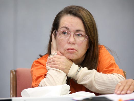 Glenna Duram, of Ensley Township near Sand Lake, listens