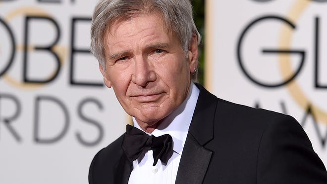 Harrison Ford is pictured arriving at the 73rd annual Golden Globe Awards in Beverly Hills, Calif. Newly released video showed a plane piloted by Ford mistakenly flying low over an airliner that was taxiing at a Southern California airport.
