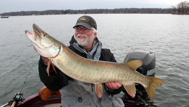 Mike Koepp of Pewaukee holds a 40-inch musky caught on Pewaukee Lake in Pewaukee, Wis.
