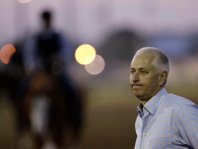Trainer Todd Pletcher watches some morning workouts at Churchill Downs Thursday, May 3, 2012, in Louisville, Ky. (AP Photo/Charlie Riedel)