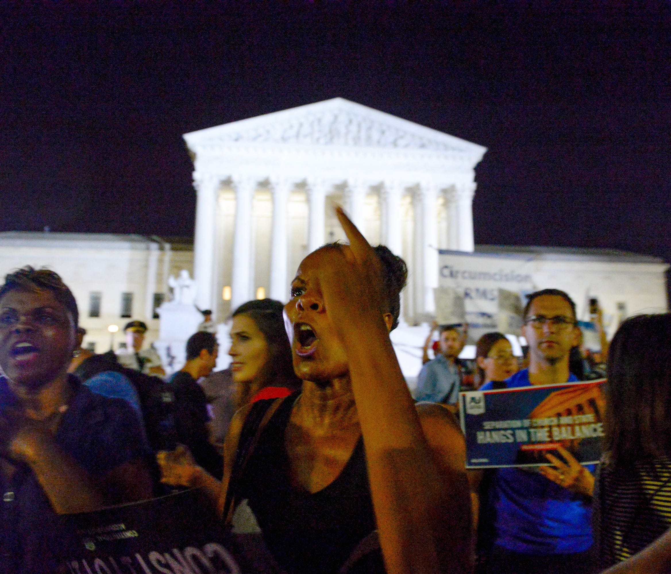 Pro-life and pro-choice groups clash outside of the Supreme Court to protest or support Donald Trump's Supreme Court Justice Nominee, Judge Brett Kavanaugh, to replace Justice Kennedy, July 9, 2018.