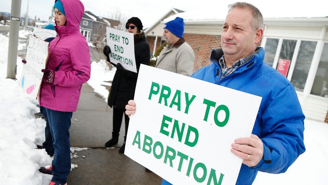 Hornell resident David Martin holds protests outside the Elmira Planned Parenthood facility Saturday.
