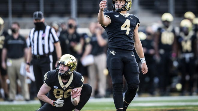 Wake Forest junior Nick Sciba (4) watches one of his kicks sail through the uprights on Oct. 17 in Winston-Salem.