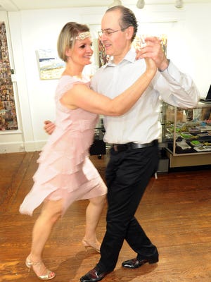 Anita Peghini and her husband practice the tango.