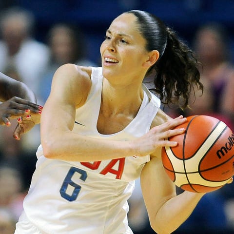 FILE - United States' Sue Bird, right, is defended