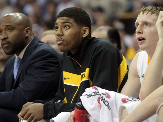 Iowa's Devyn Marble watches the Hawkeyes from the bench during their game against Michigan State at Carver-Hawkeye Arena on Thursday, Jan. 10, 2012.