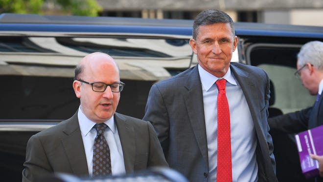 Former National Security Adviser Michael Flynn, right, makes a court appearance at U.S. District Court for the District of Columbia on July 10, 2018.