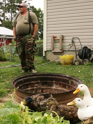 U.S. Army veteran Darin Welker raises ducks at his West Lafayette home to help treat his PTSD. The Ohio Supreme Court has declined to hear his appeal  of a village ban on most farm animals.