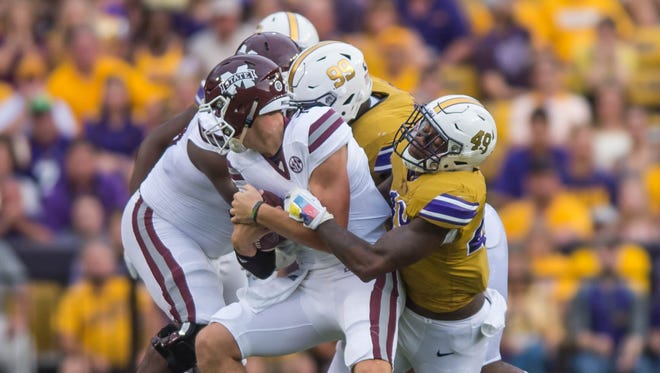 Advertiser photo by Buddy Delahoussaye--LSU Tigers defensive end Arden Key (49) sacks  Bulldogs quarterback Nick Fitzgerald (7) during the first half of a SEC game between Mississippi State and the LSU Tigers in Death Valley on Saturday Sept. 17, 2016.